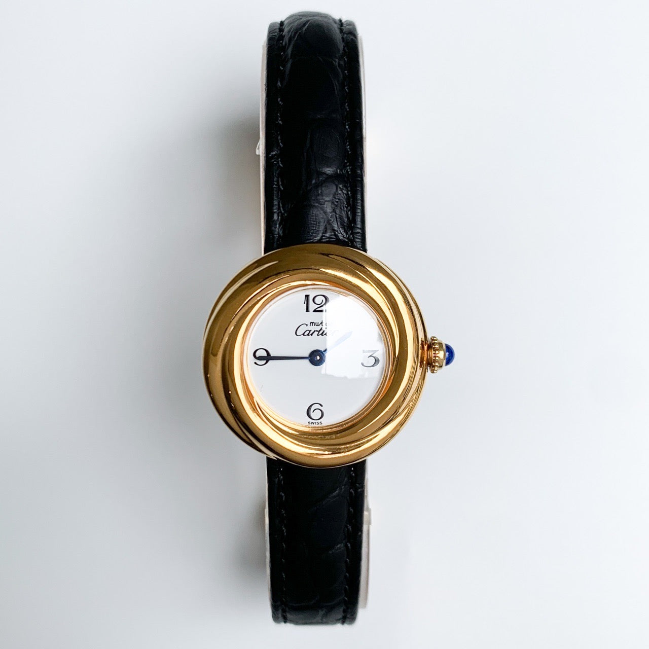 Trinity watch, small model, jumping hour display, Arabic numerals, gold