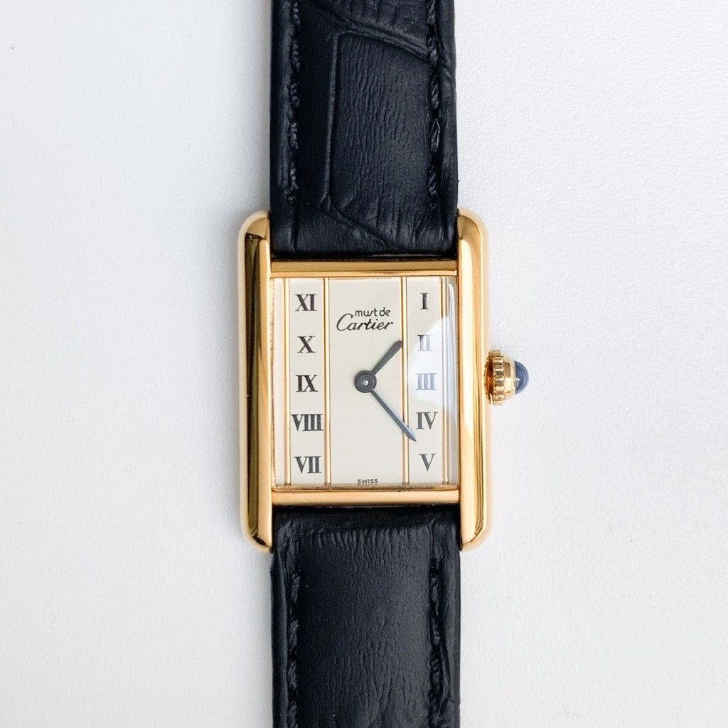 Must Tank, small, vertical Roman numeral dial, gold