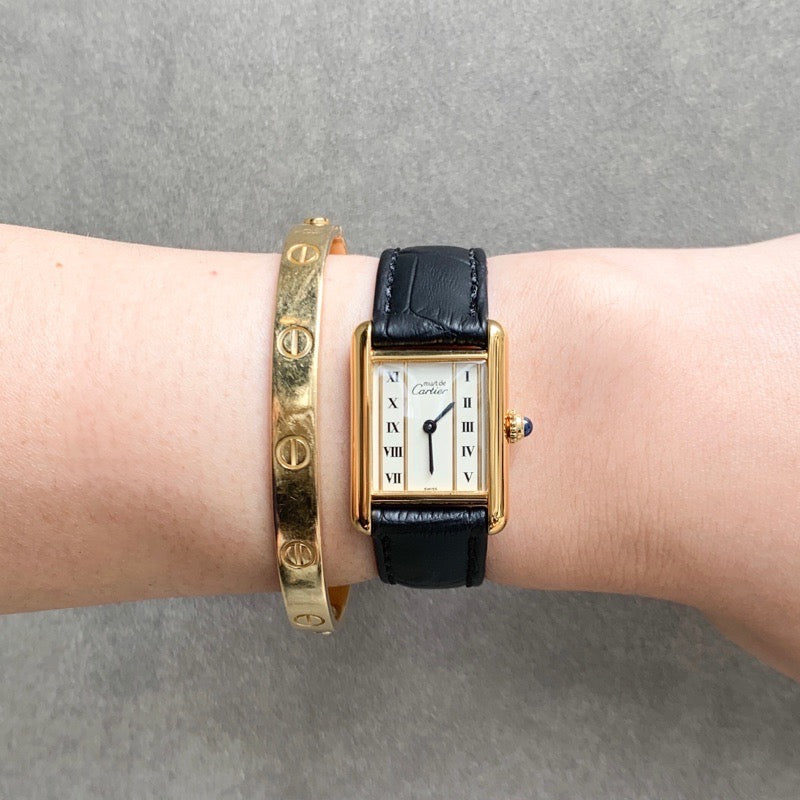 Must Tank, small, vertical Roman numeral dial, gold
