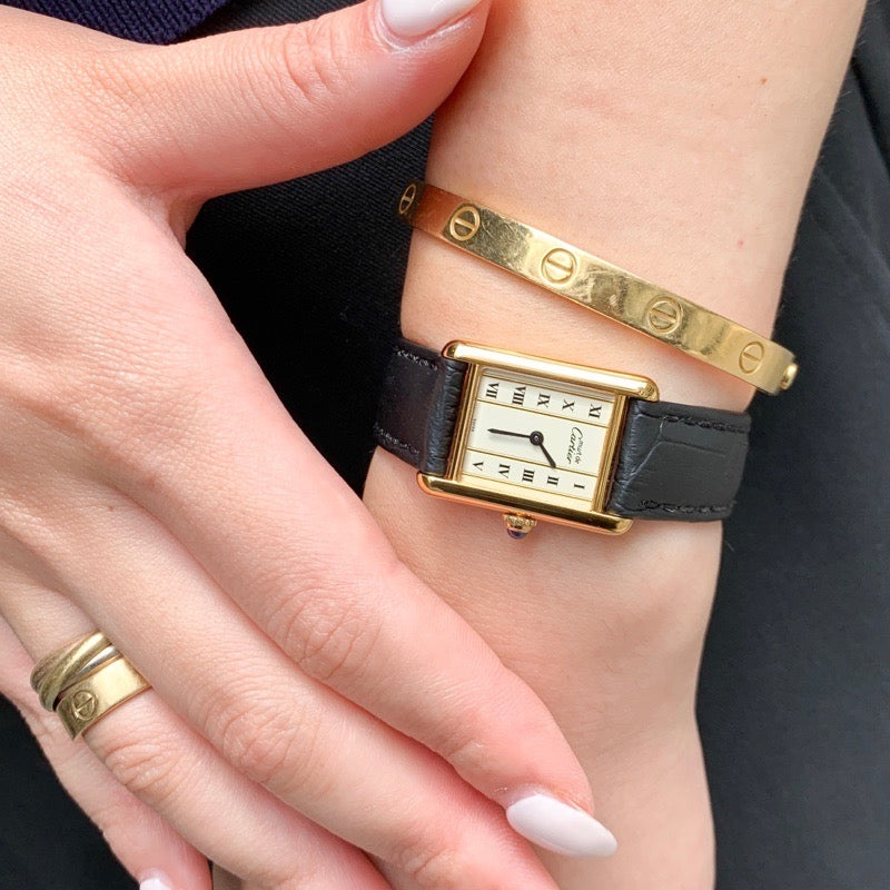 Must Tank, small, vertical Roman numeral dial, gold