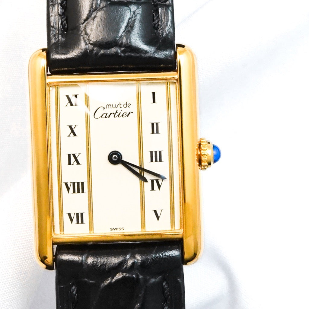 Must Tank LM, vertical Roman numerals, gold dial