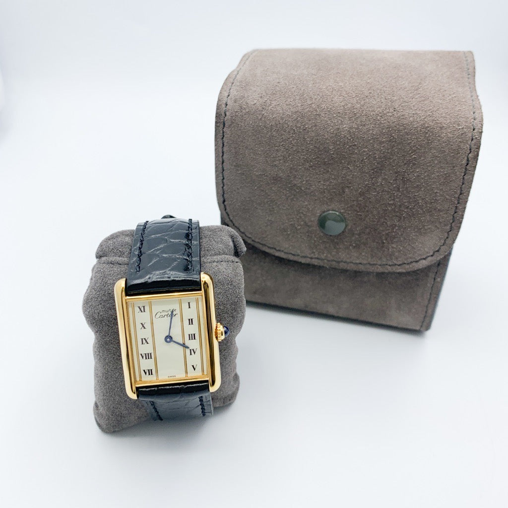 Must Tank LM, vertical Roman numerals, gold dial