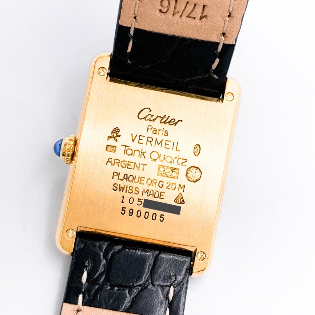 Must Tank LM, vertical Roman numerals, gold dial