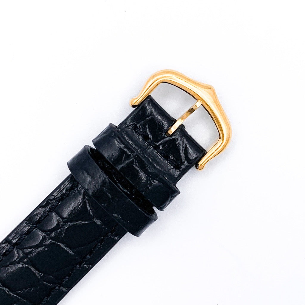 Must Tank LM, vertical Roman numerals, gold dial