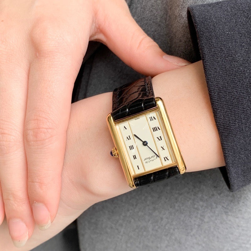 Must Tank LM, vertical Roman numerals, gold dial