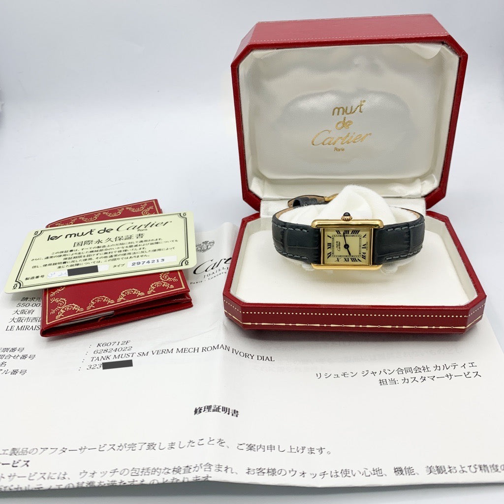 Must Tank SM, manual-winding, beige Roman dial, gold