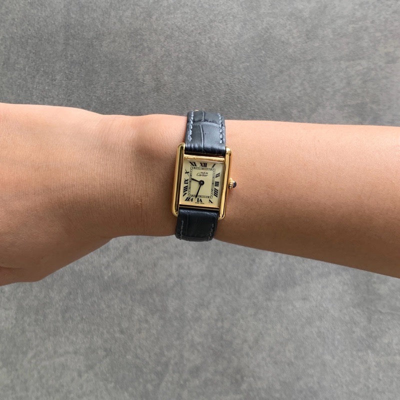 Must Tank SM, manual-winding, beige Roman dial, gold